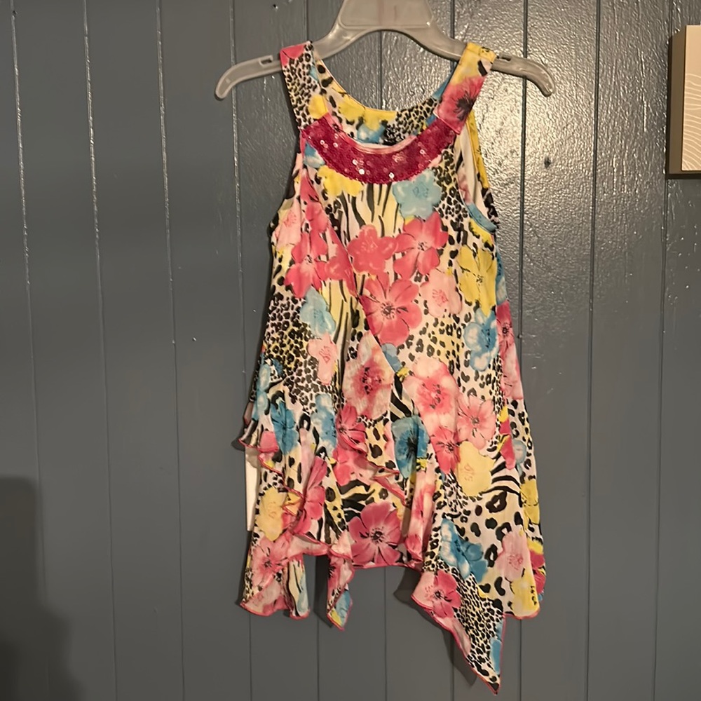 Girls pogo club girly top. Size 10/12 asymmetrical at the bottom. Very colorful